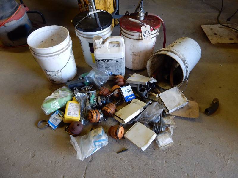 2, Liquid pumps and 5 gallon pails. 1, with hydraulic oil.. Not sure of the liquid in the other.. Other items as pictured