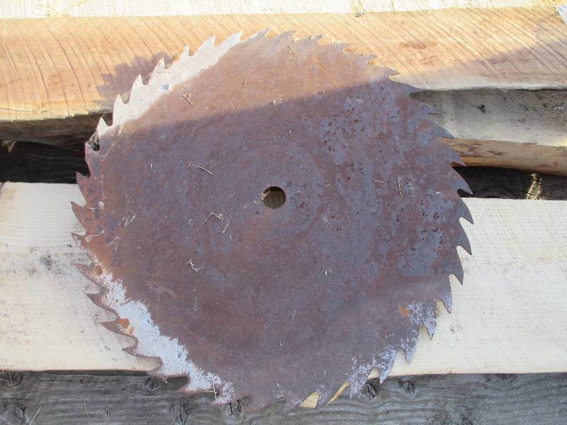 2 foot round saw blade, 1 12 cent...