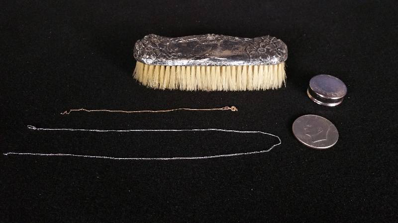 lot 40 image: Repousse Sterling Horsehair Brush, Sterling Compact, Sterling Chain, 14k Gold Chain, Silver Dollar