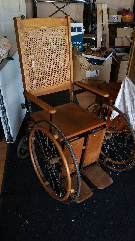 lot 7 image: Antique Cane Back Wooden Wheelchair
