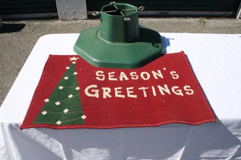 Seasons Greetings doormat and Christmas tree stand