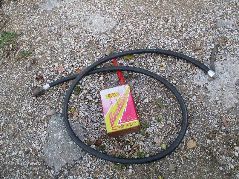 lot 91 image: gas can and hose...