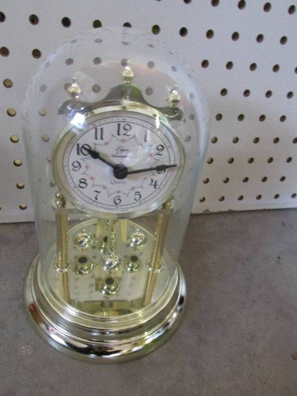 Elgin clock made in USA under a gla...