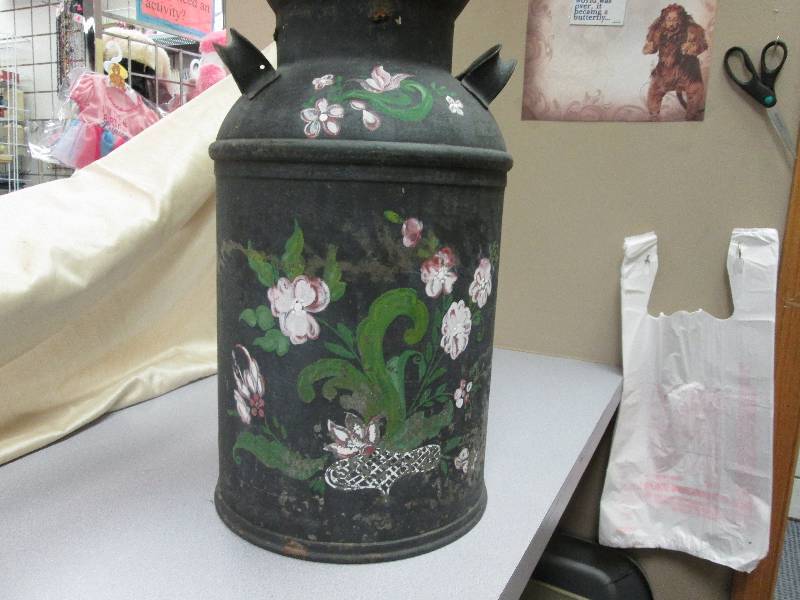 Old style metal milk container....