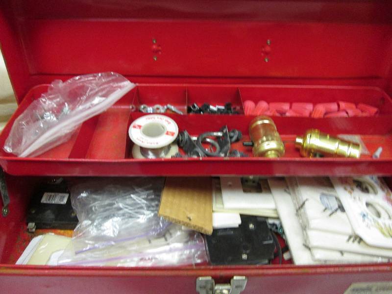 red tool box of misc household item...
