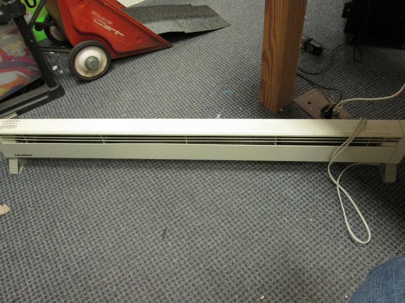 oil space heater roughly 5 feet lon...