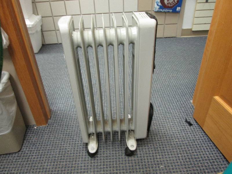 oil space heater roughly stands 2 f...