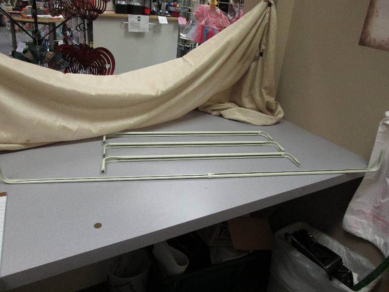 4 extendable curtain rods...