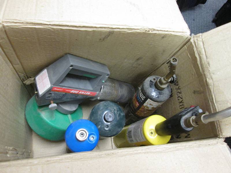 box of propane tanks and torches an...