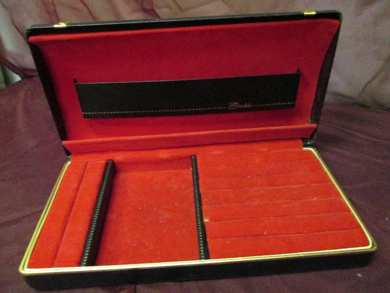 Hard case black hinged jewelry case...
