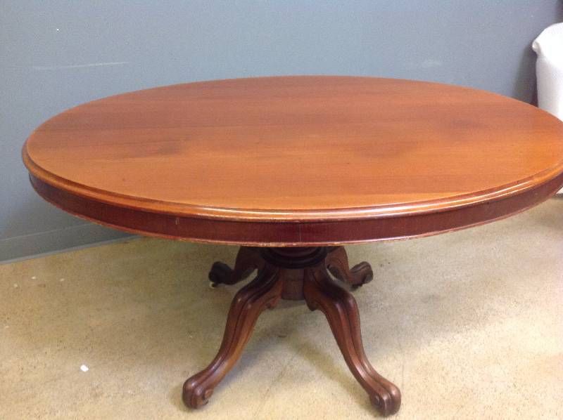1860s English Oval Mahogany Breakfast Table on Porcelain Casters