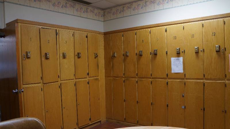 Large Built In Wood Corner Storage or Employee Locker