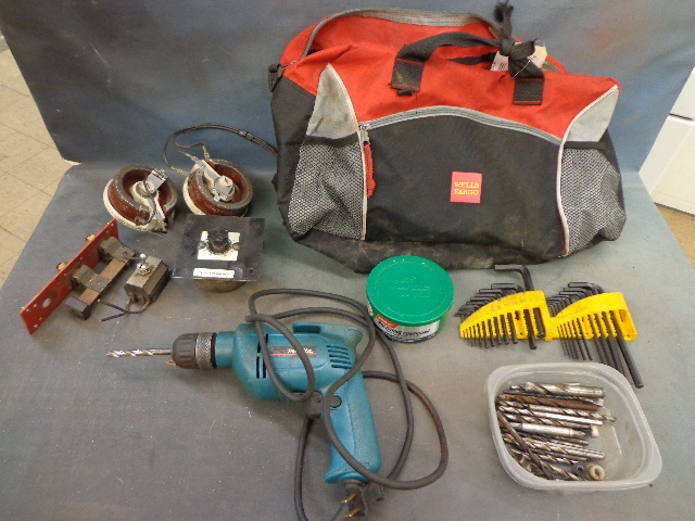 lot 205 image: Red Duffle Bag Full Of Tools