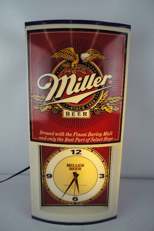 lot 98 image: Miller Beer Lighted Electric Clock