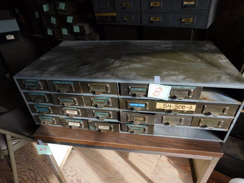 24 drawer metal cabinet 3 drawers are missing see photos