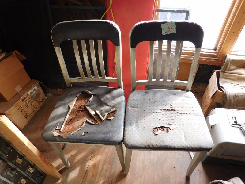 two vintage metal desk chairs both need recovering