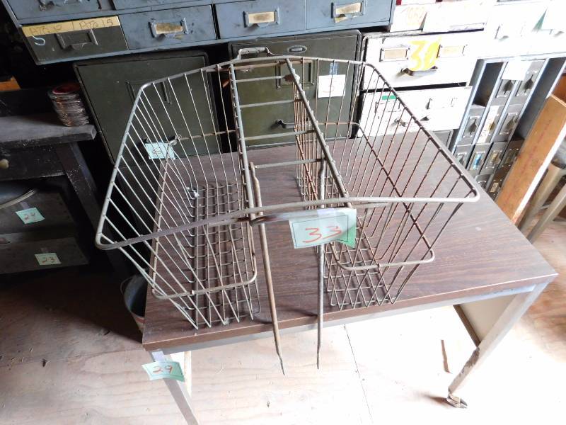 vintage wire basket mounts onto back of vintage bicycle