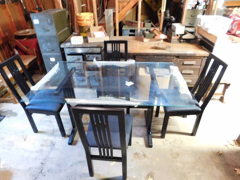 Glass top table with mission style base and chairs