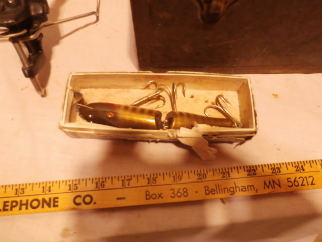 Metal tackle box includes some contents