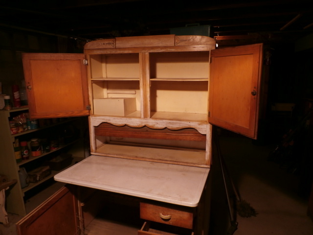 Antique freestanding bakers cabinet with flour bin, bread box and roll up front