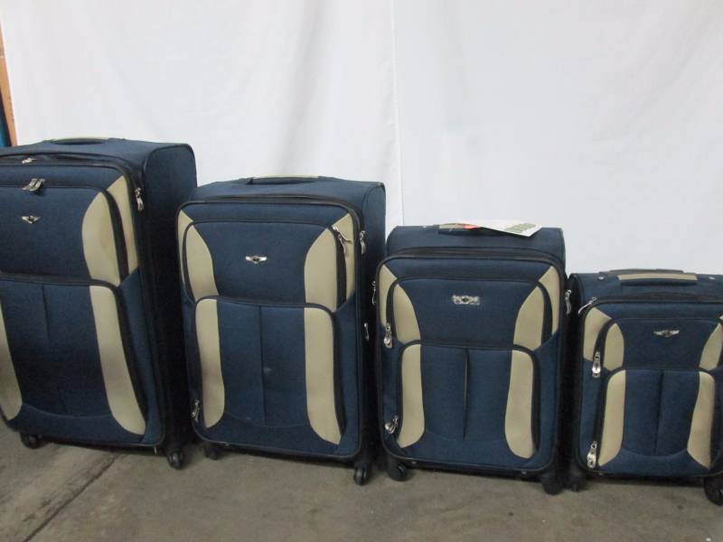 lot 21 image: Quad 4-pc. Spinner Luggage Set