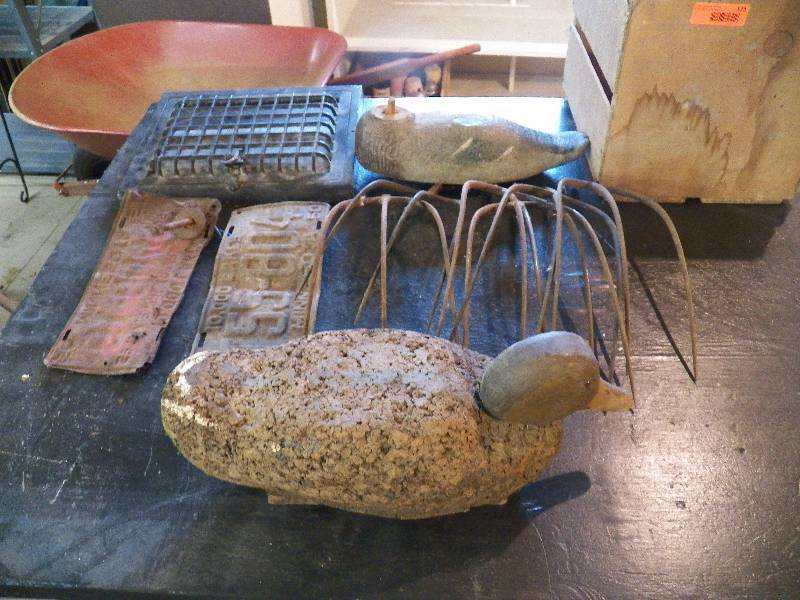 Wood box, cork duck, fork heads, grate, old license plate