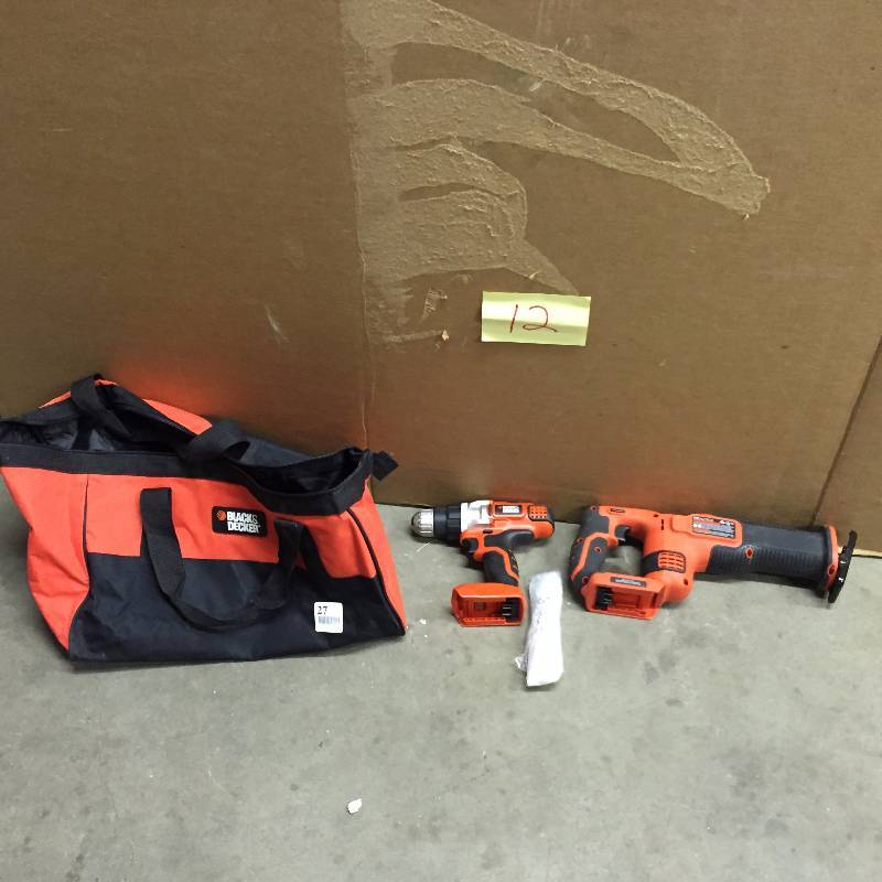 lot 12 image: Black and Decker Drill and Saw Kit- no battery or charger