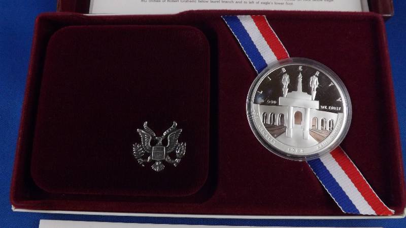 1984 Silver Olympic Dollar coin, in box with papers