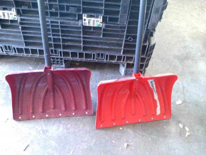 2 plastic snow shovels