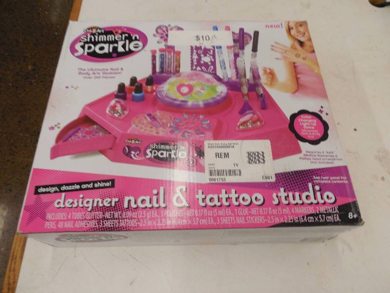 lot 34 image: DESIGNER NAIL AND TATTOO STUDIO