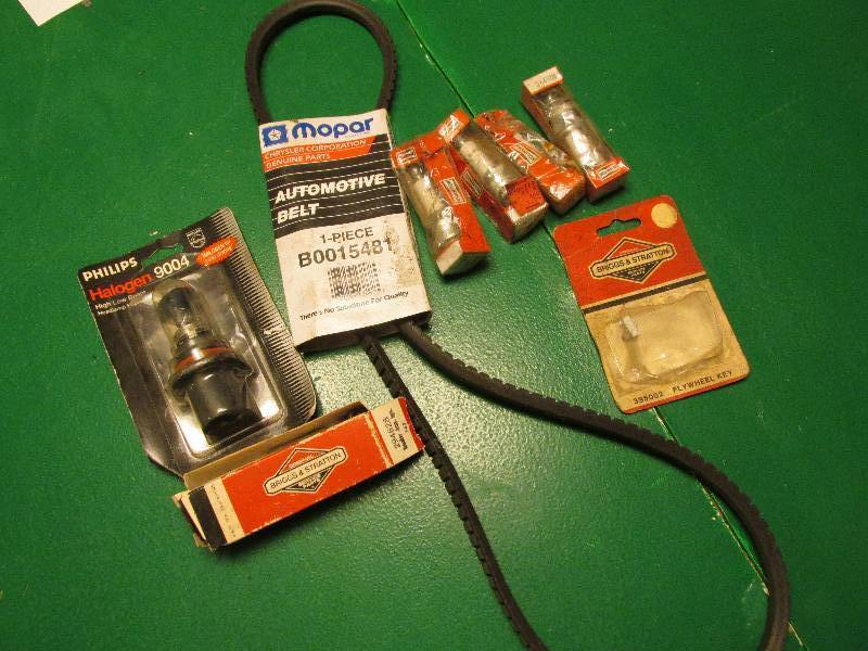 lot 42 image: Mopar belt, halogen headlight, flyw...