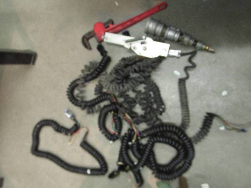 lot 111 image: Lot of cords, pipe wrench with no a...