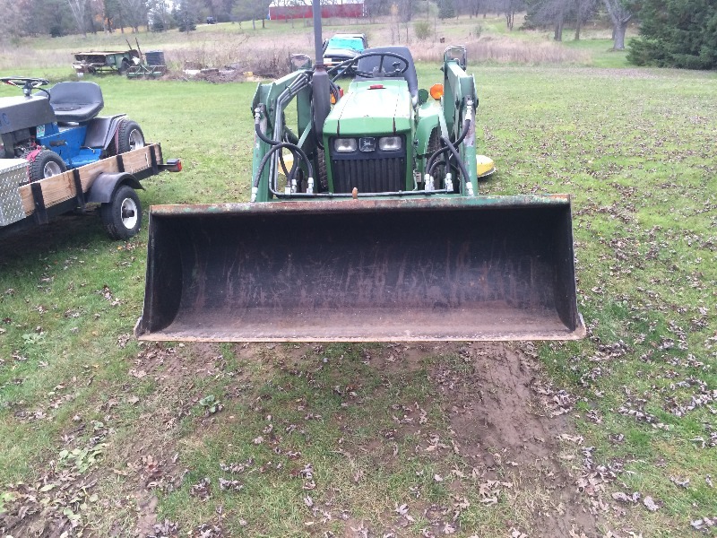 lot 1 image: John Deere 650 Tractor wfront loader, mower deck and Scraper, 3 point - Runs Great
