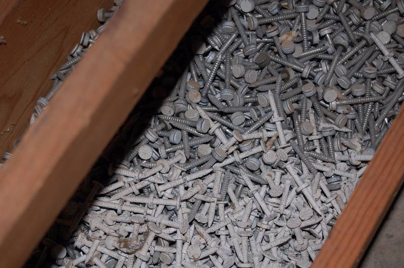 Half a crate of 1 12 all weather nails.