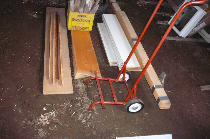 lot 98 image: Misc Shelves, grade Stakes, Septic Risers Tonged and Grove cedar and 2 wheel cart