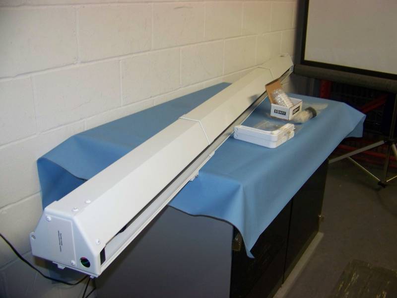 lot 25 image: Da-Lite, Cosmopolitan, Powered, Projection  Movie Screen with Mounting Brackets and Somfy Control