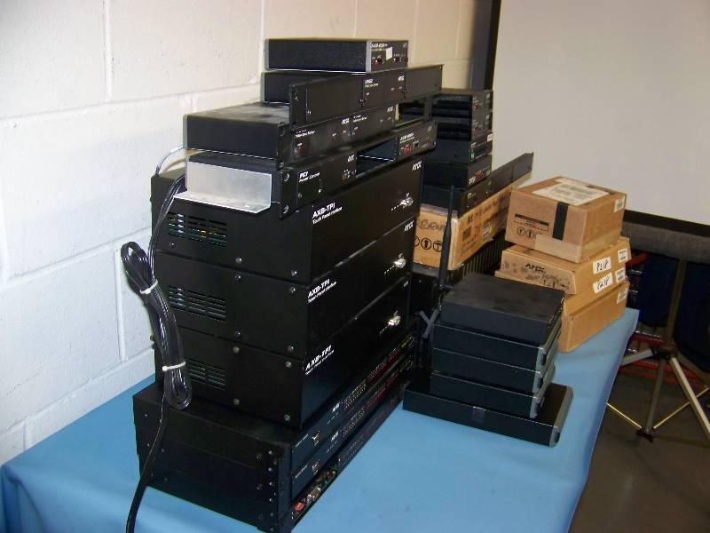 lot 41 image: LARGE lot of AMX  Panja Power Supplies, Interface Units, Breakout Boxes, TV Monitors, Presenter, Controllers and more