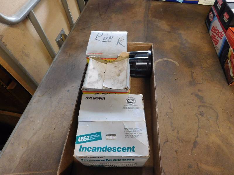 lot 32 image: three distributor caps and a headlight