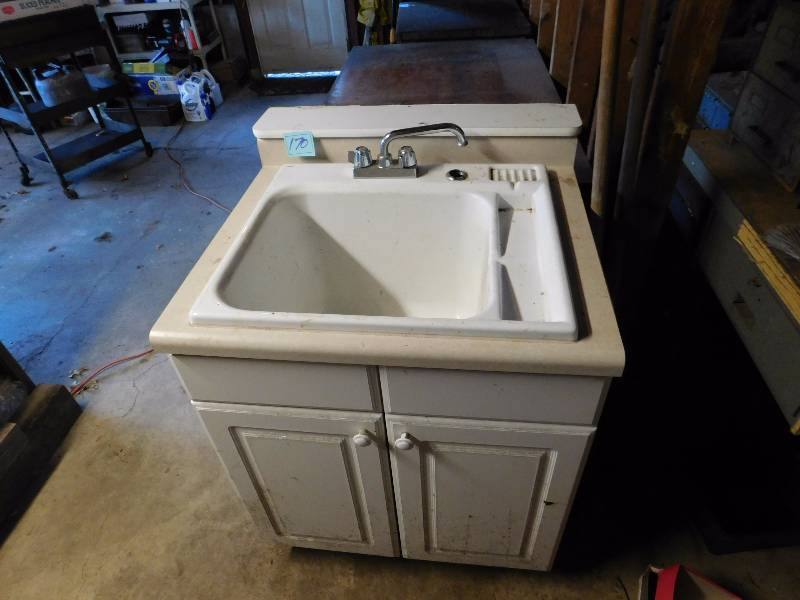 lot 70 image: vintage deep sink and vanity with plumbing and faucet worked when removed