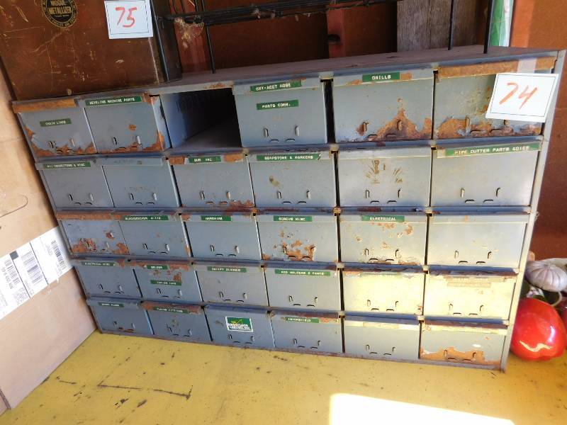 lot 74 image: vintage  metal 24 drawer unit....one drawer is missing