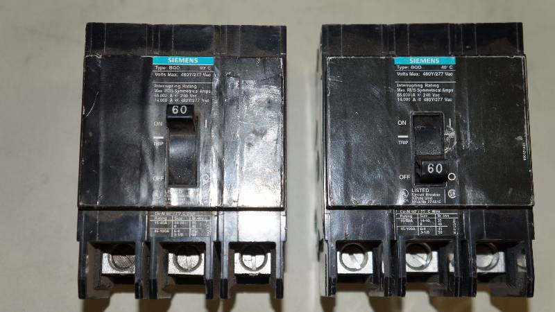 lot 202 image: Qty 2 Siemens 60 Amp Type BQD 480Y277 VAC Interrupting Rating 3 Pole Bolt On Circuit Breakers