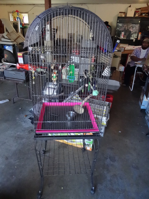 lot 121 image: metal birdcage with toy and accessories on wheels