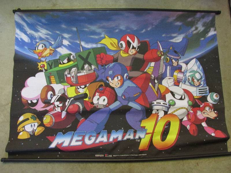 lot 16 image: Magaman10 roll up posters 32 tall...