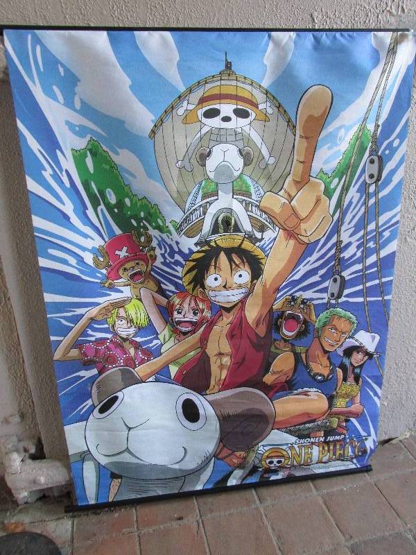 lot 18 image: Shonen Jump One Piece roll up poste...