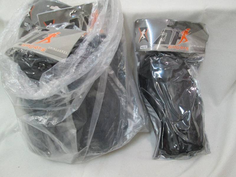 lot 83 image: Lot of 6 black new hockey shin guar...