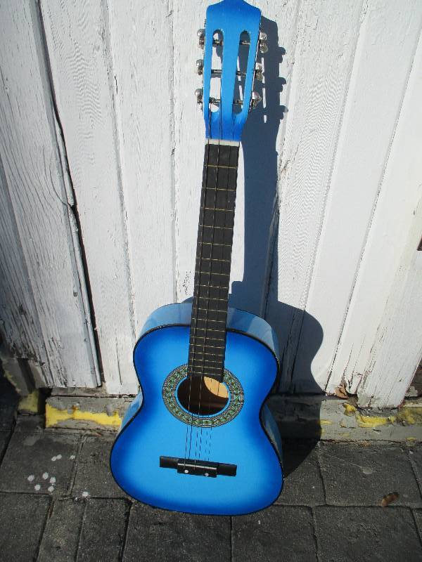 Blue smaller size guitar, missing o...