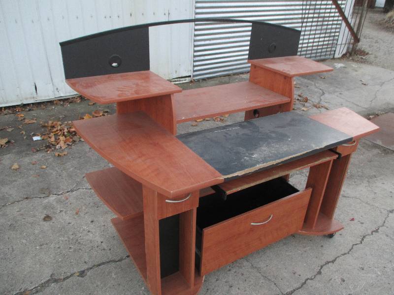 Computer desk on wheels with lots o...