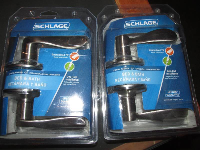 lot 129 image: 2 Schlage door knobs...