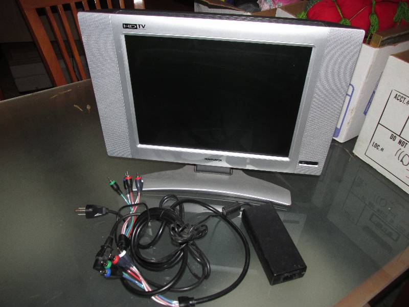 lot 106 image: Magnavox HD TV with cords...