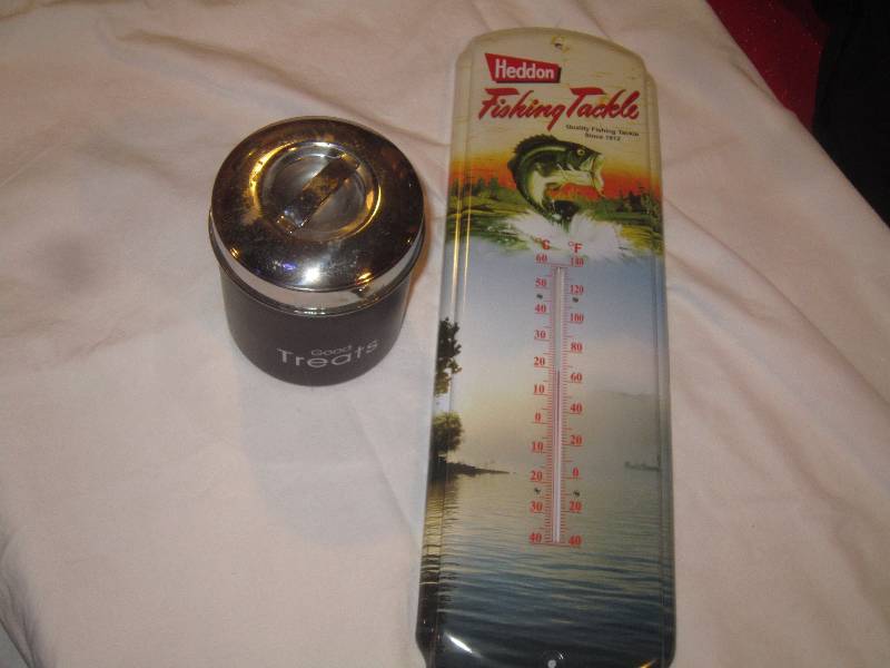 lot 24 image: LOT - Treat Tin and Heddon Fishing Tackle Therometer